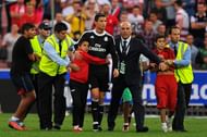 pitch invader hugs Ronaldo